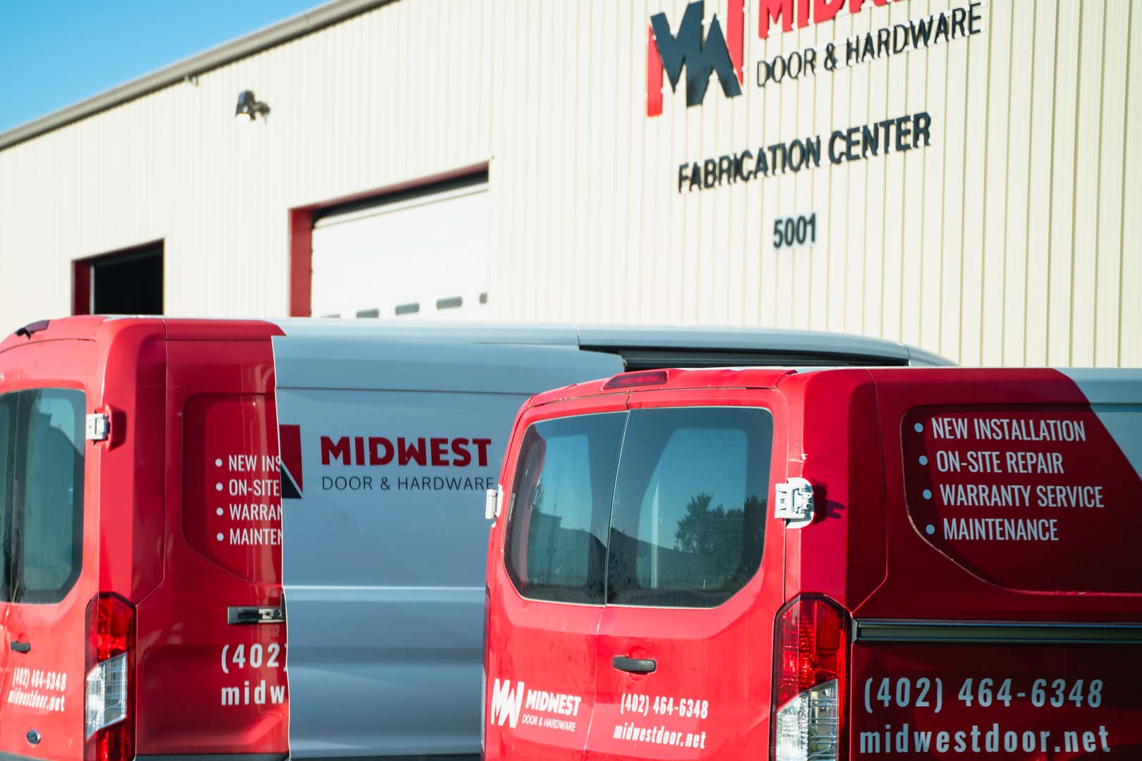 Midwest Door service vans outside the Lincoln fabrication center