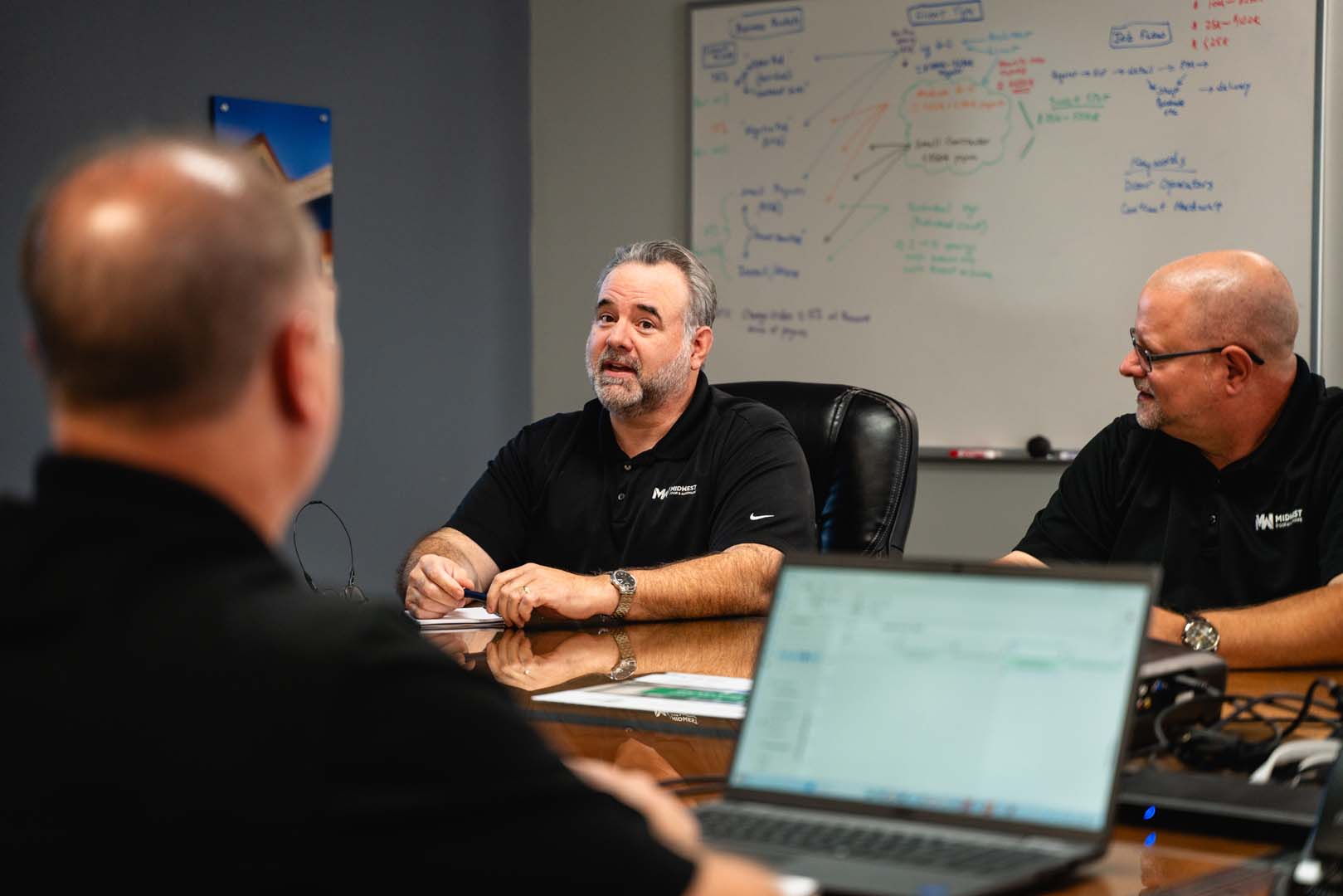 Midwest Door estimators reviewing a door and hardware schedule together